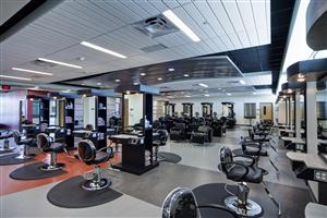 Salon photo of chairs and shampoo bowls