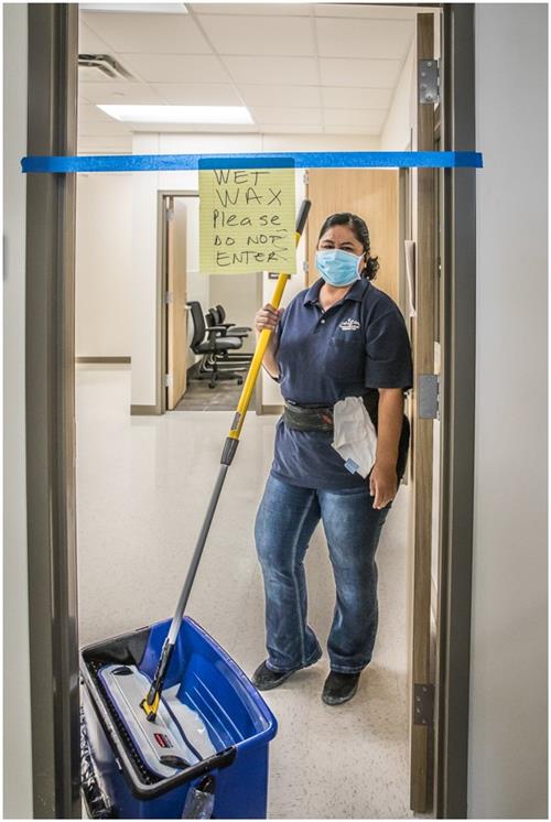 District workers wax floors 