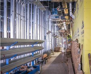 rock wal at new admin building near complete