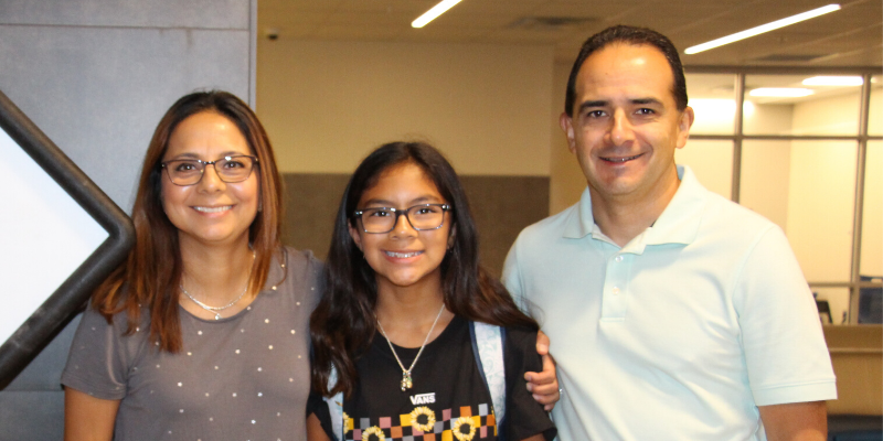 picture of two parents and student